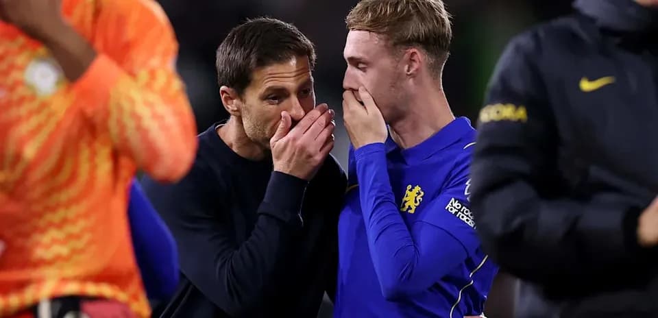 Coach and player discussing after match conclusion