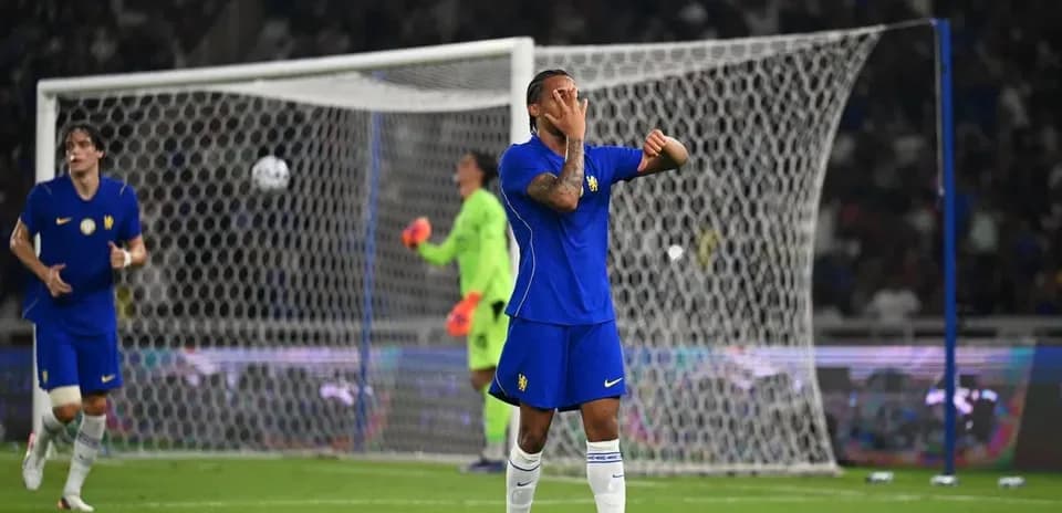 Player reacting during a soccer match with goalpost in background