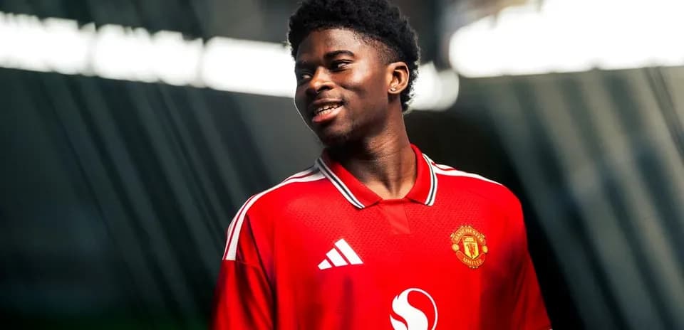 Player wearing Manchester United jersey during photo shoot