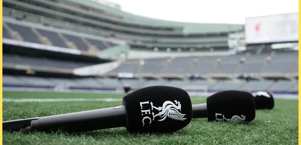 Microphones with LFC logo on stadium field