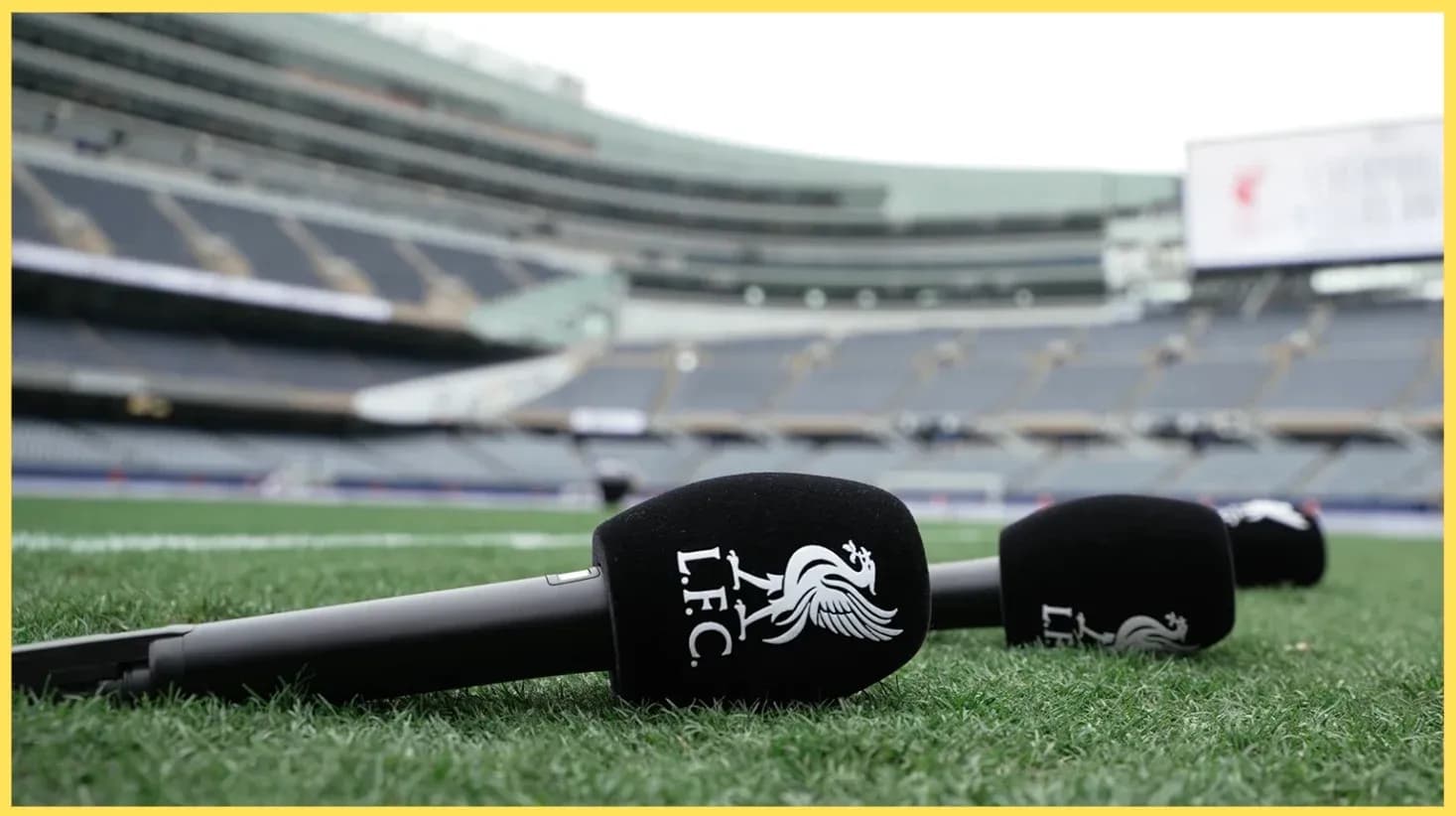 Microphones with LFC logo on stadium field