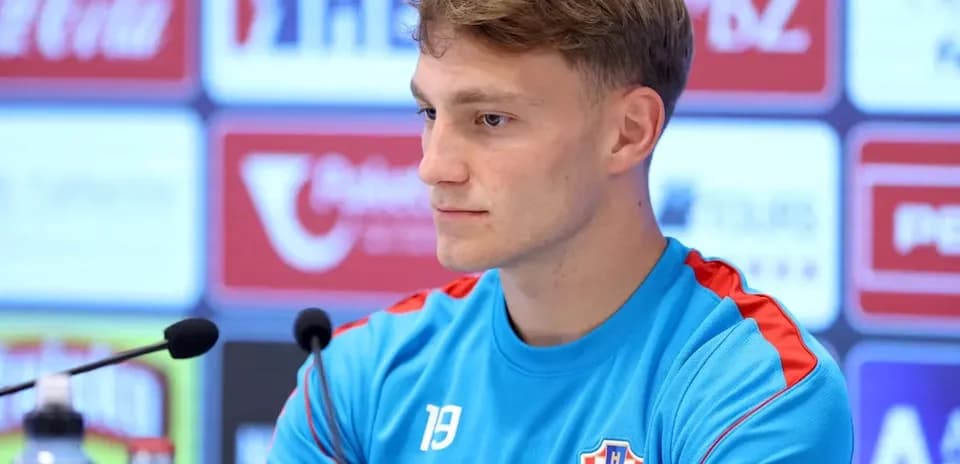 Player at press conference with Croatia jersey