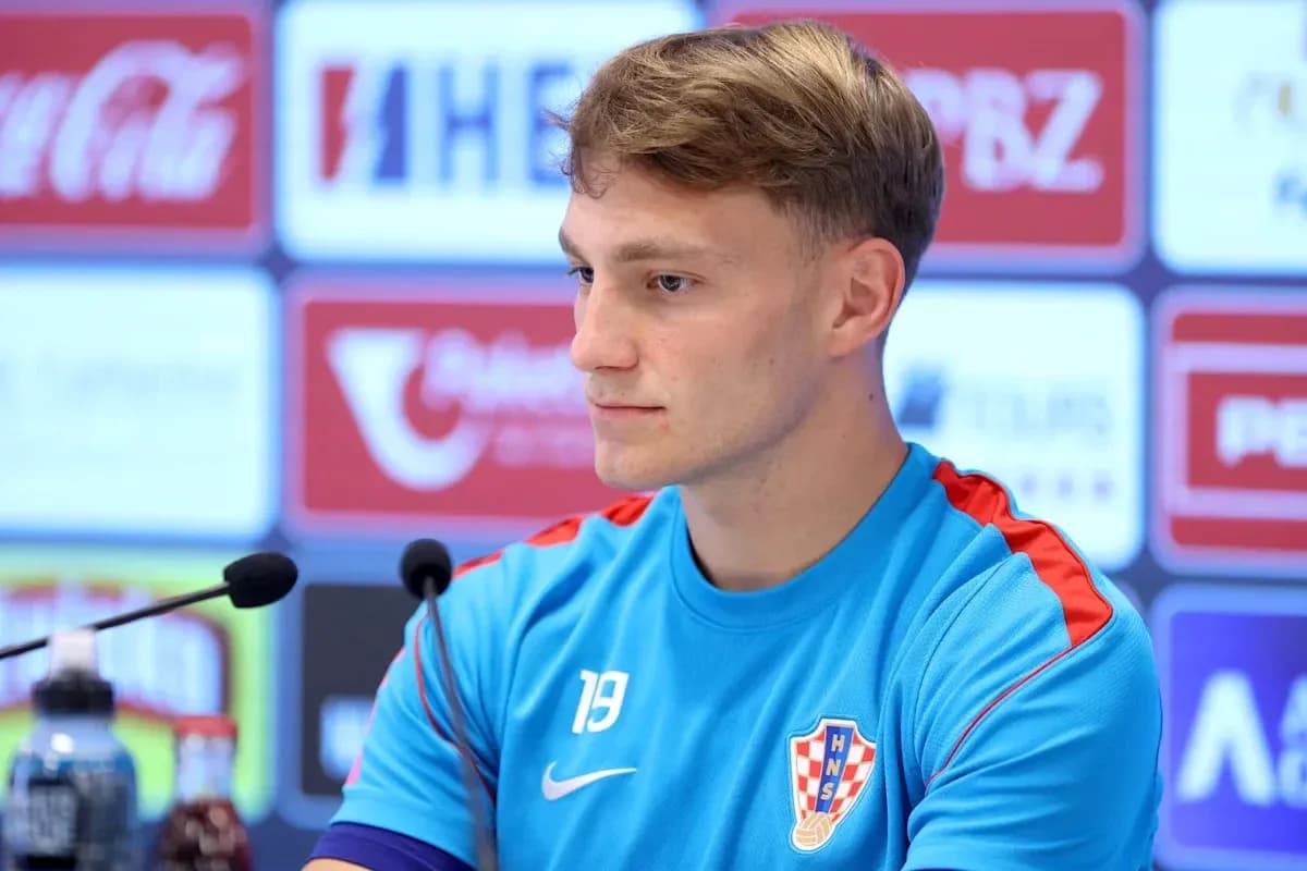 Player at press conference with Croatia jersey