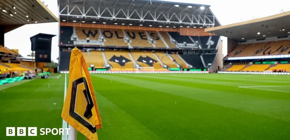 Corner flag in front of empty stadium seating