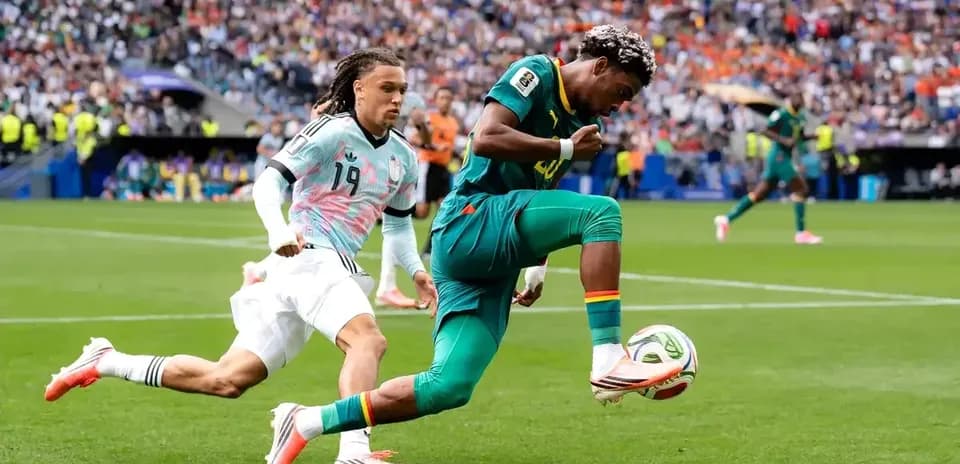 Player dribbling the ball during a football match