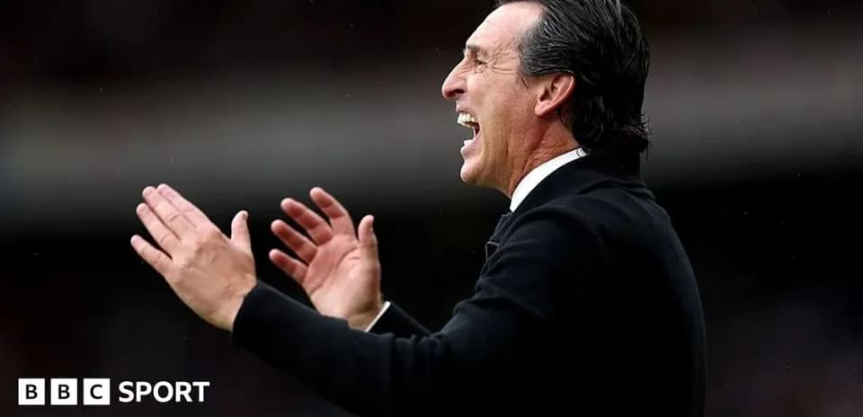 Manager gesturing during a match from the sidelines