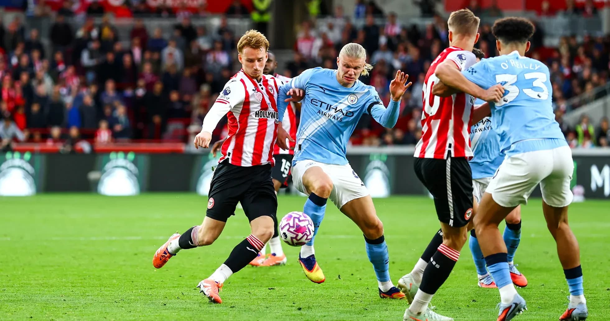 Players competing for the ball in match action