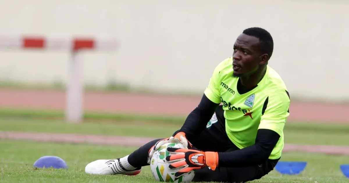 Goalkeeper training on the field with soccer ball