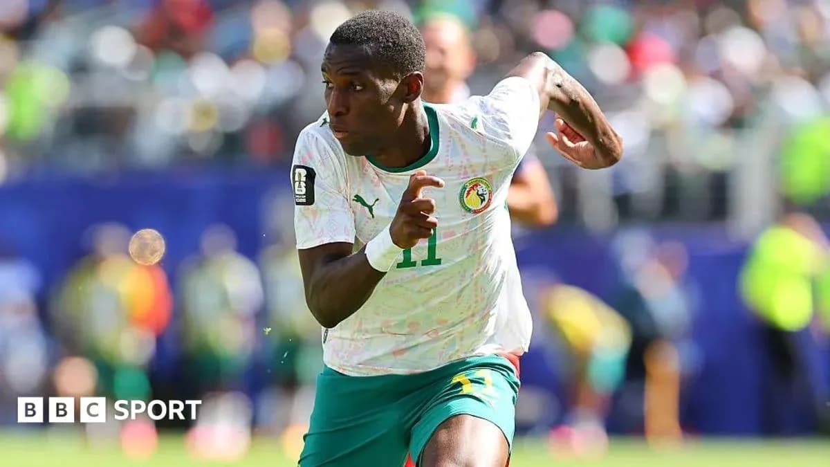 Senegal player sprinting during a football match