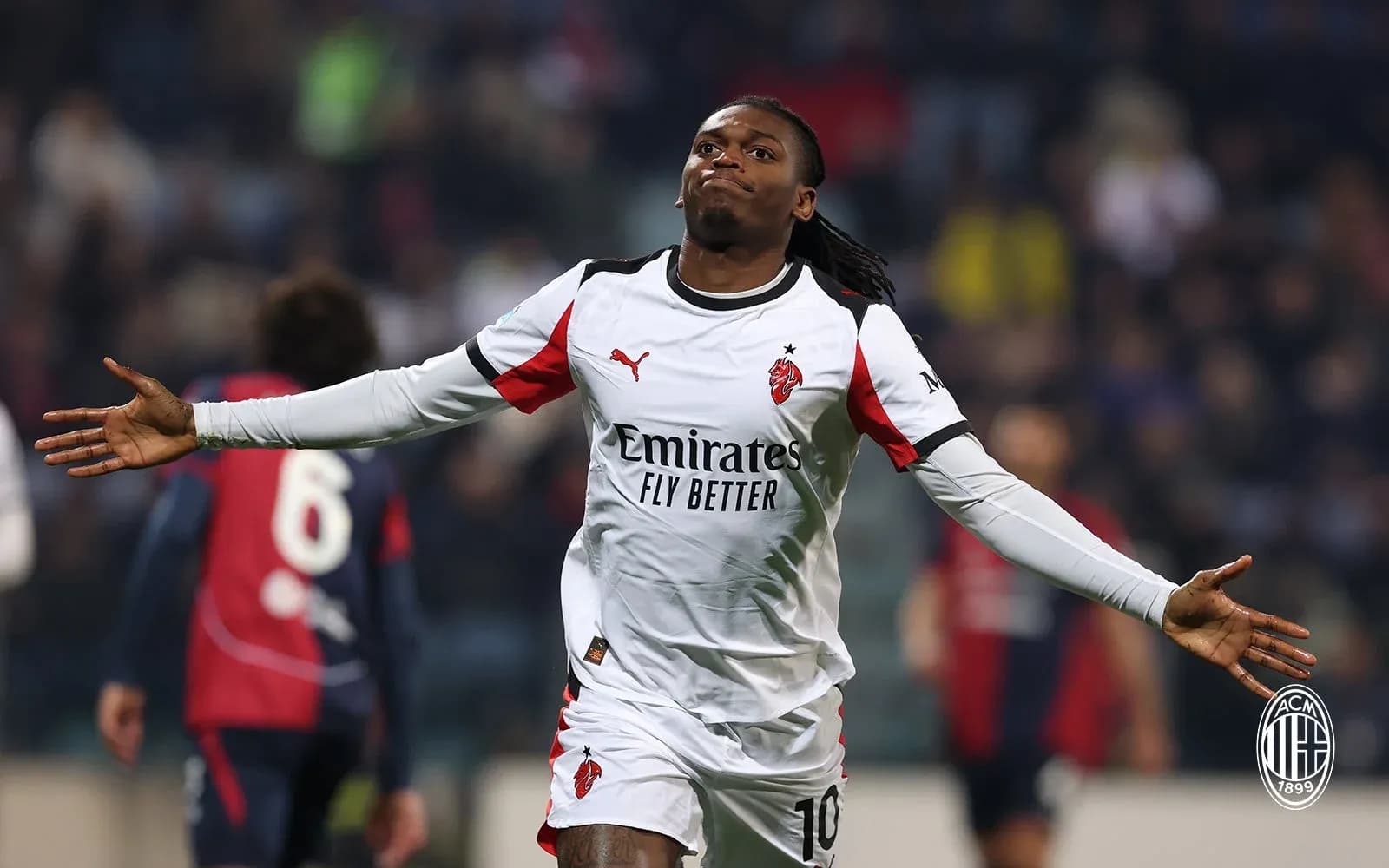 Player celebrating after scoring goal for AC Milan
