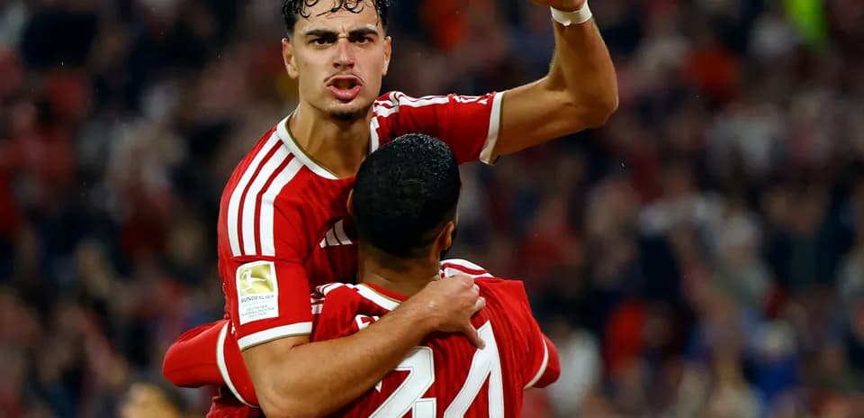 Player celebrating goal with teammate during match