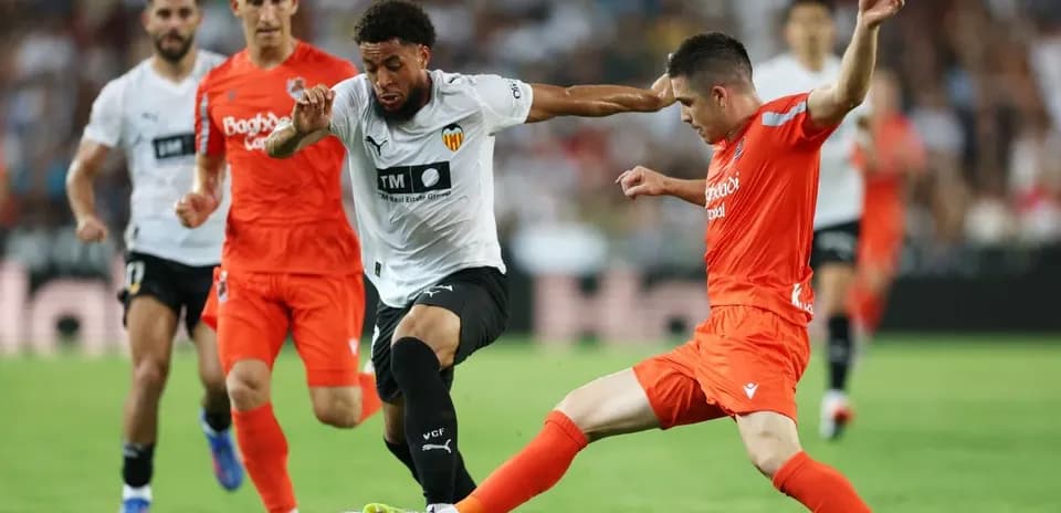 Players contesting during Real Sociedad vs Valencia match