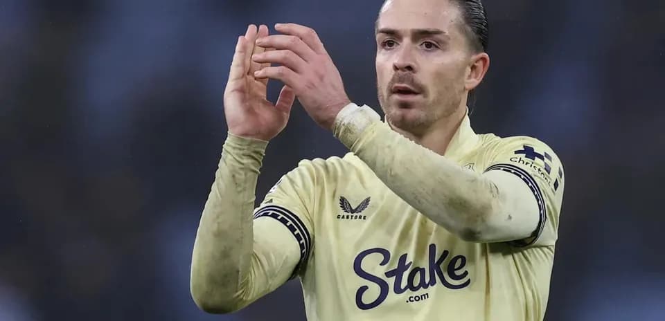 Player applauding fans wearing a yellow jersey