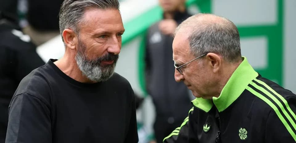 Two coaches greeting each other before the match