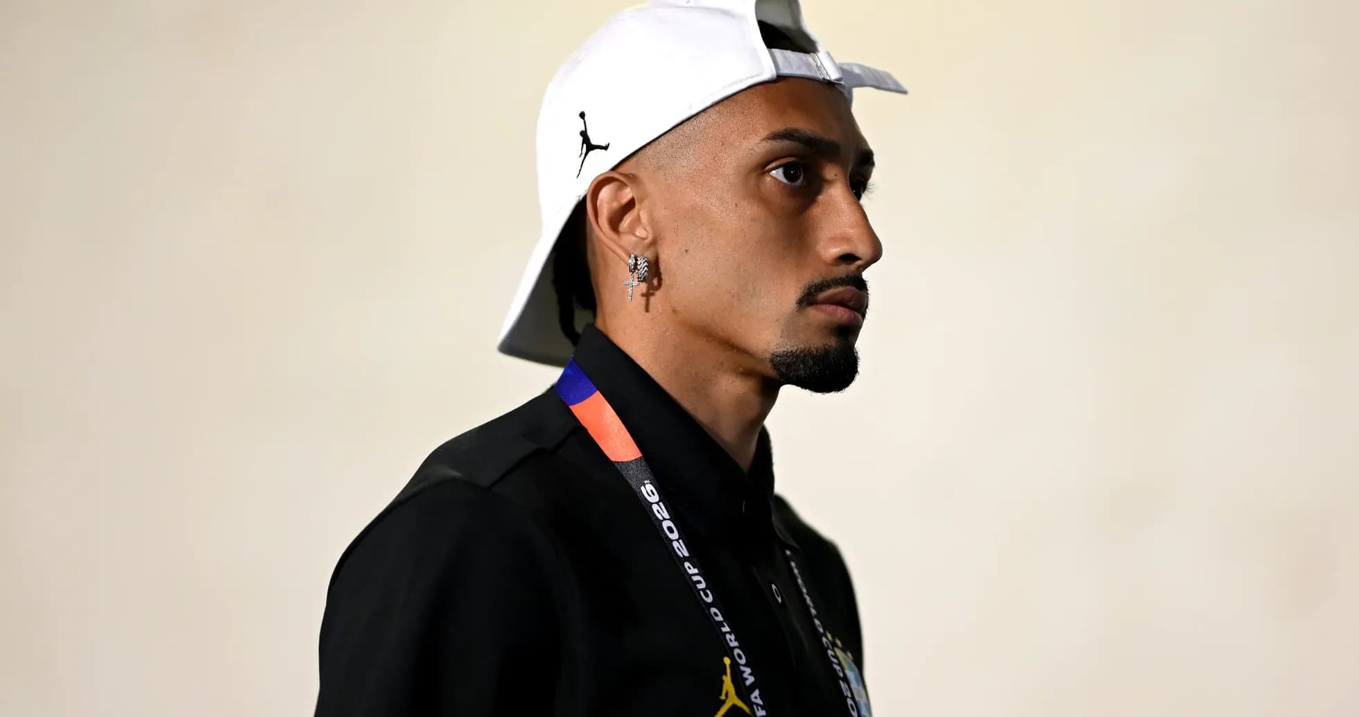 Athlete wearing cap and lanyard at event