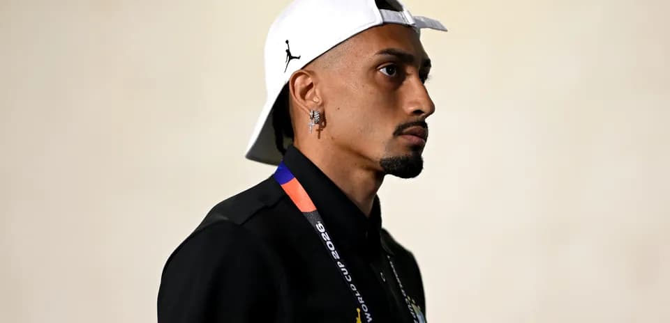 Athlete wearing cap and lanyard at event