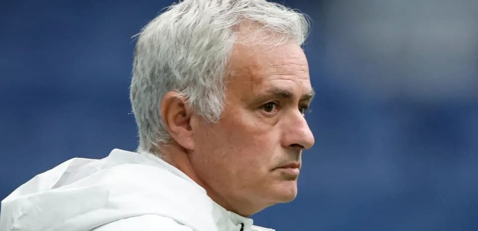 Coach observing during match with serious expression