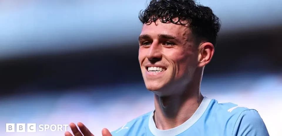 Player smiling and applauding fans after match