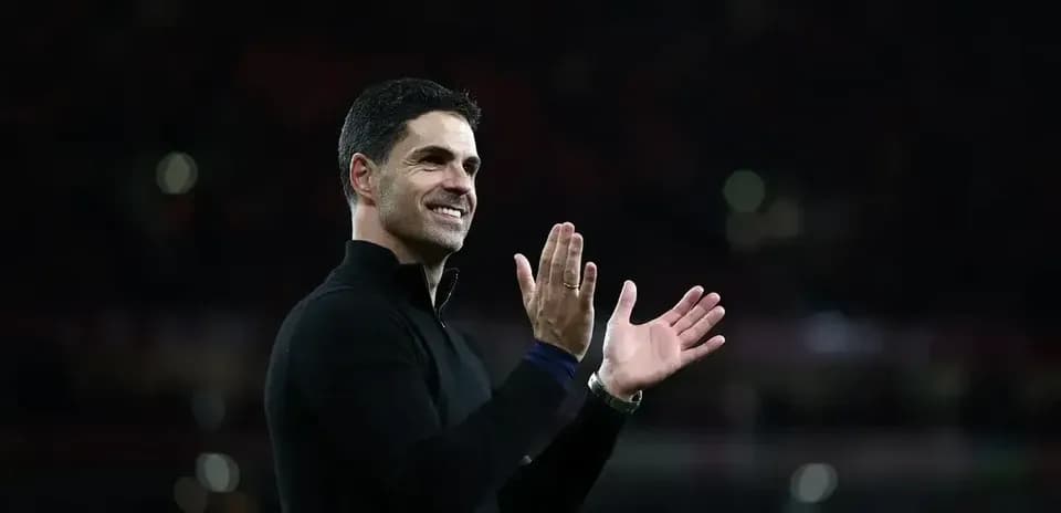 Coach applauding fans during a match celebration