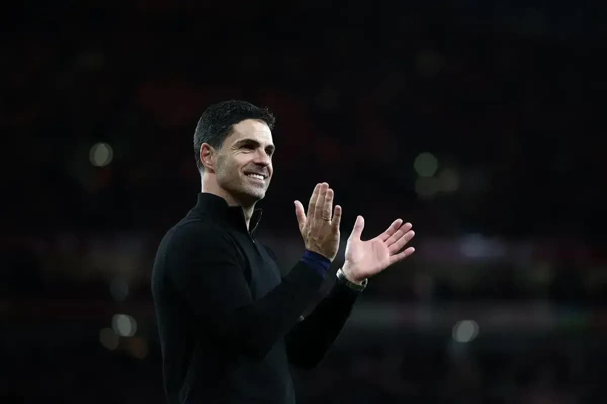 Coach applauding fans during a match celebration