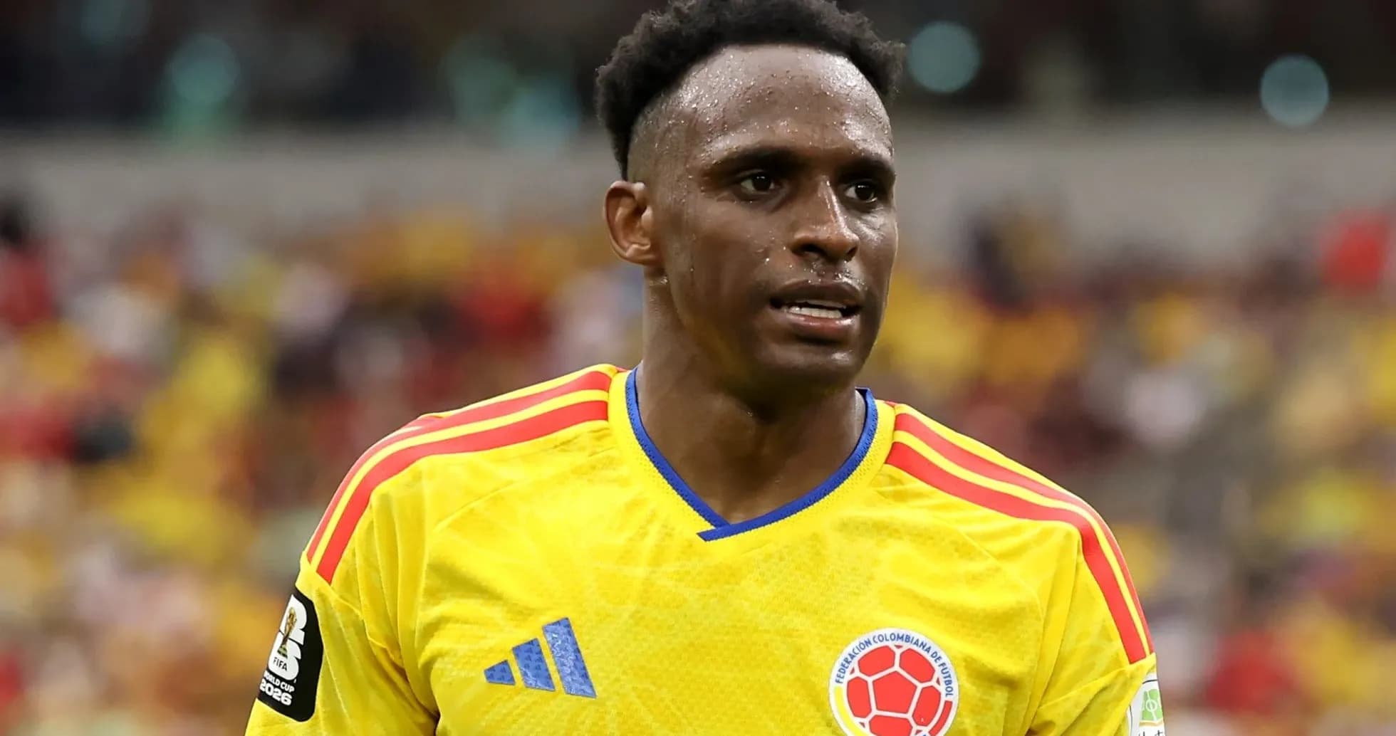 Player in yellow Colombia jersey during match