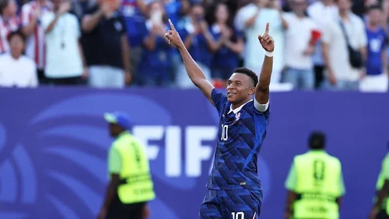 Player celebrating a goal with fans in background