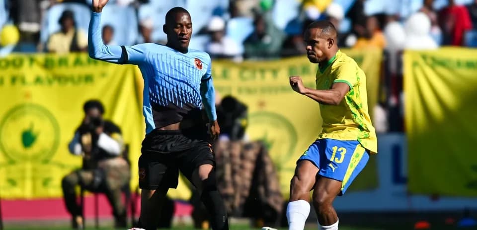 Two players competing for the ball during a match