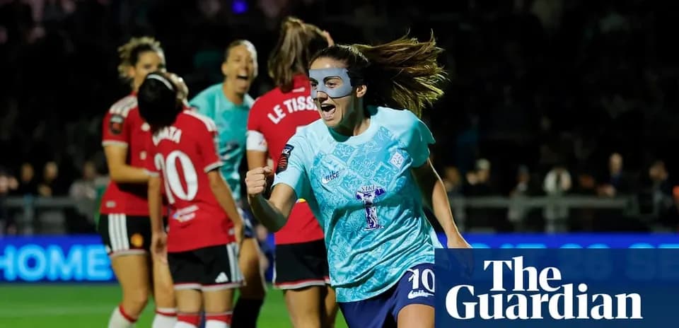 Player celebrating goal during women's football match
