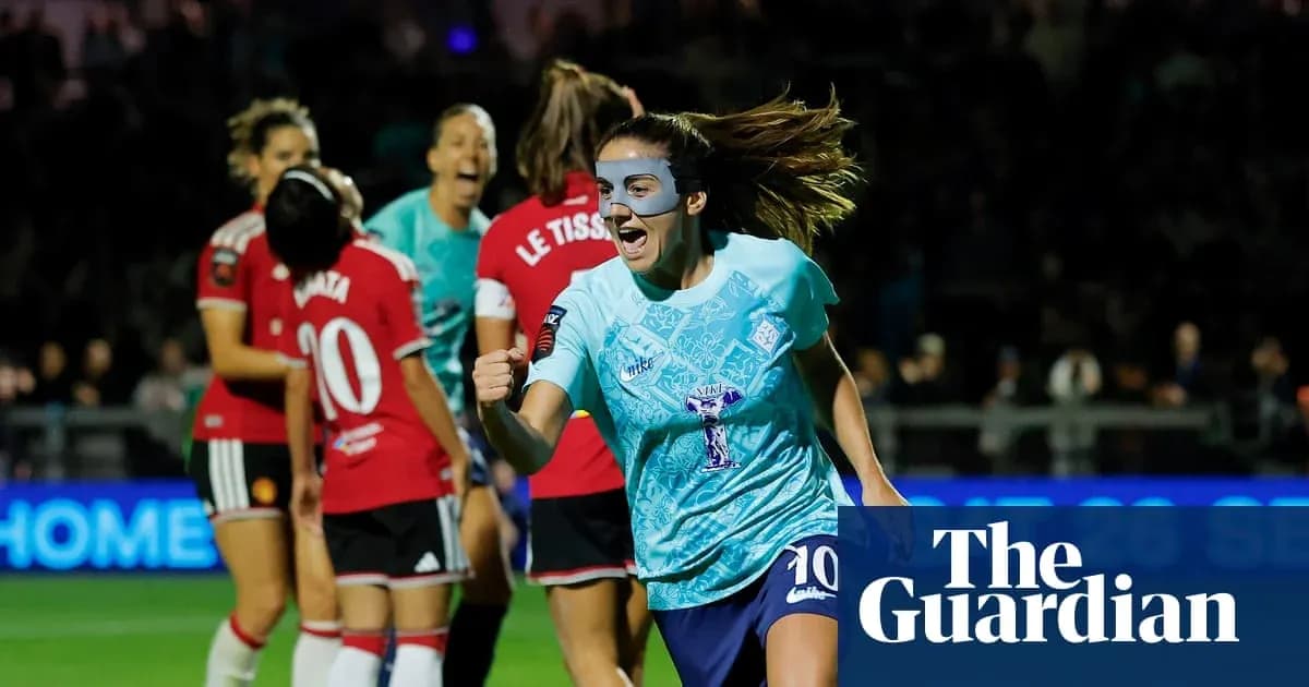 Player celebrating goal during women's football match