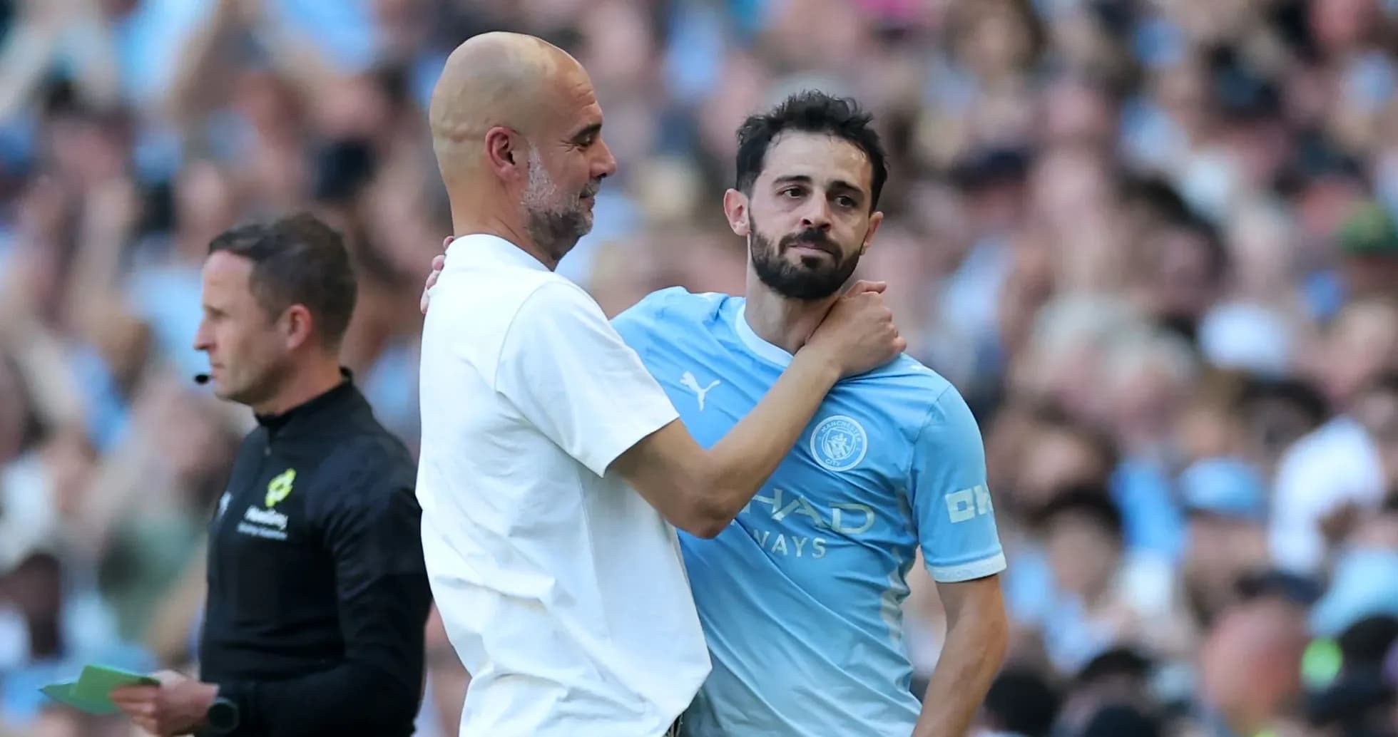 Pep Guardiola embracing Bernardo Silva on the pitch