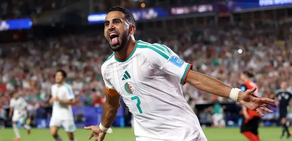 Algerian player celebrating goal during match