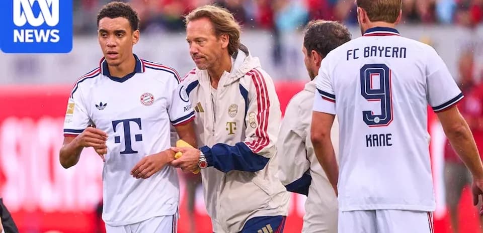 Bayern Munich players interacting during match substitution