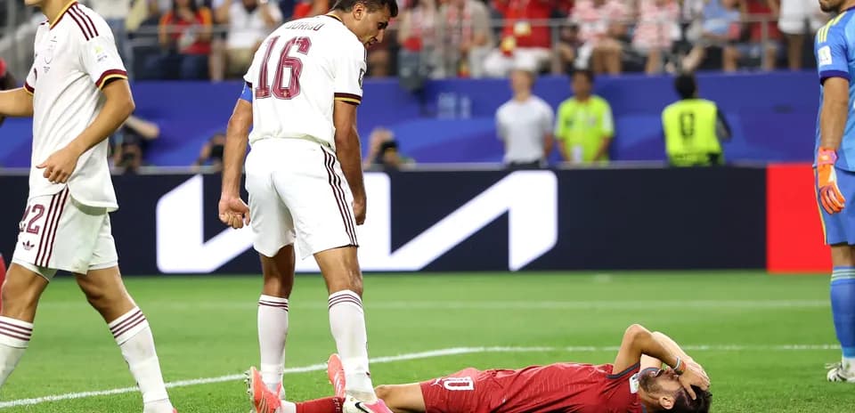 Player lying on the ground after a challenge
