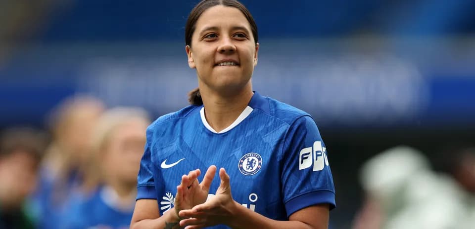 Player in blue Chelsea kit clapping hands