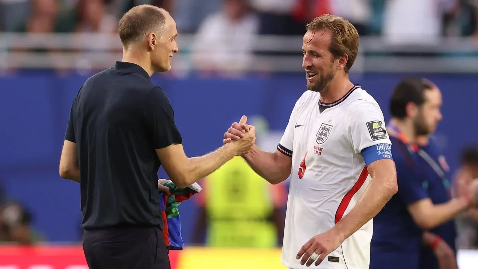 Manager and player shaking hands after match