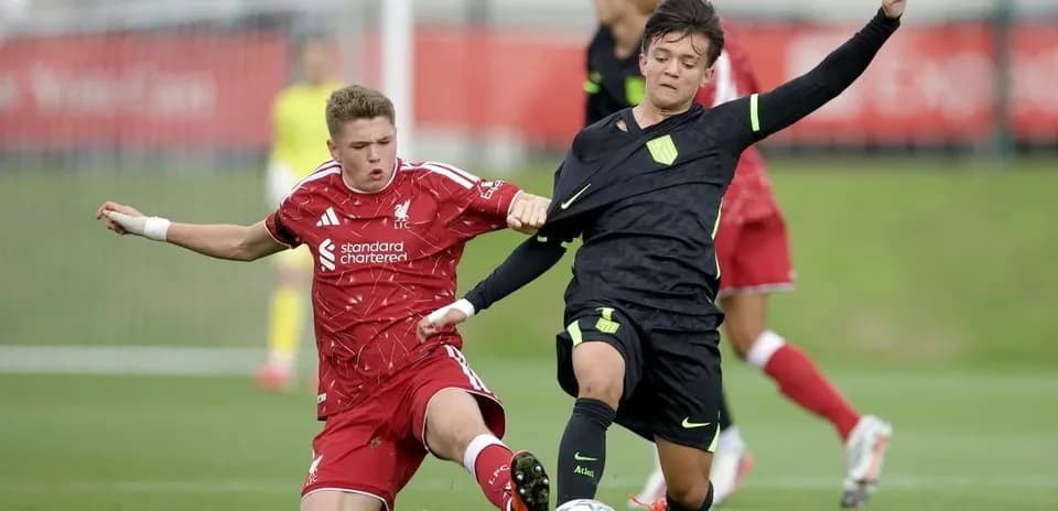 Two players contesting for the ball during match