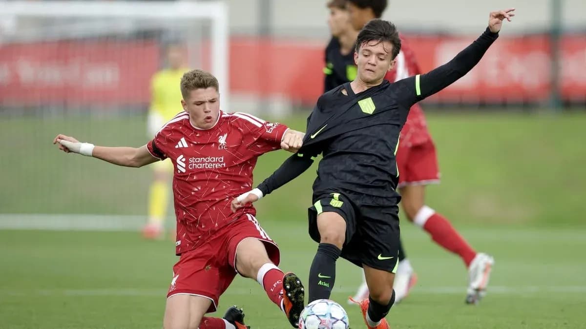 Two players contesting for the ball during match
