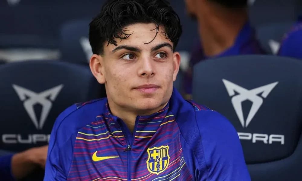 Player sitting on bench during match warm-up