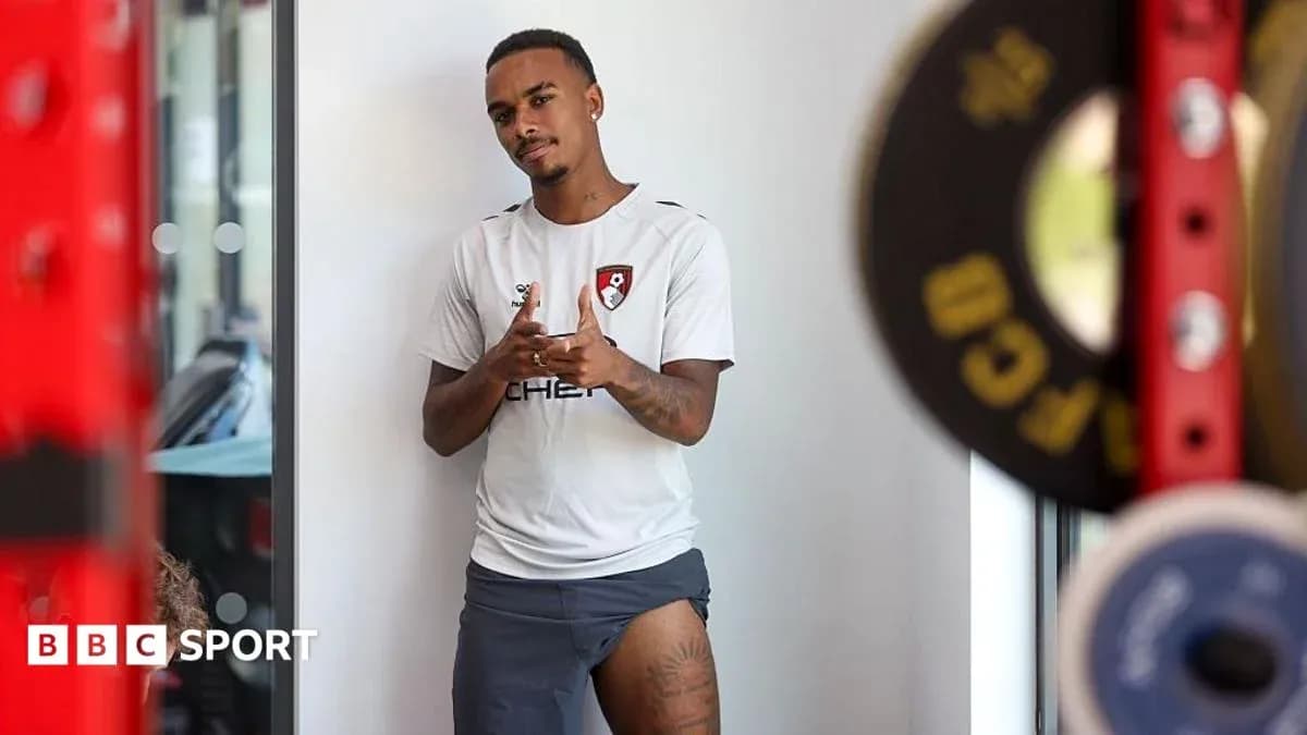 Player posing in training gear at gym