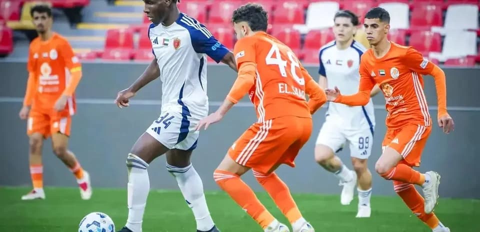 Al Sharjah U23 player dribbling past opponents