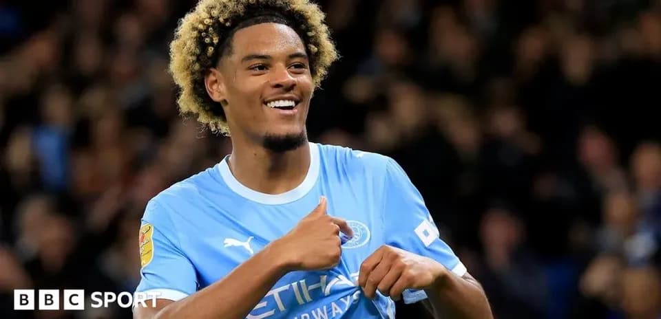 Player celebrating a goal in Manchester City jersey