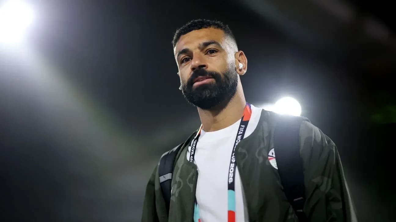 Player walking with a backpack at stadium