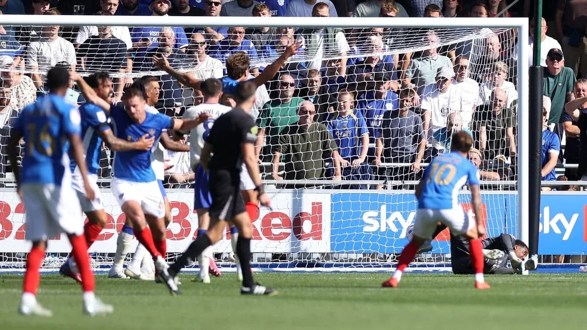 Players in action during a goal-scoring moment