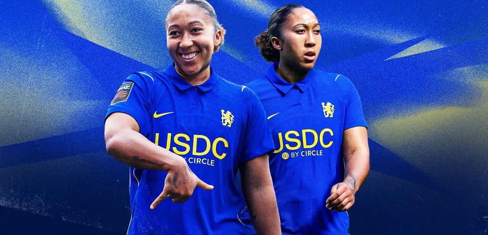 Player in blue Chelsea kit posing confidently