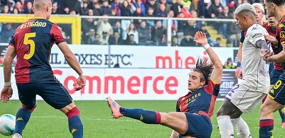 Genoa player fouling Fiorentina opponent during match