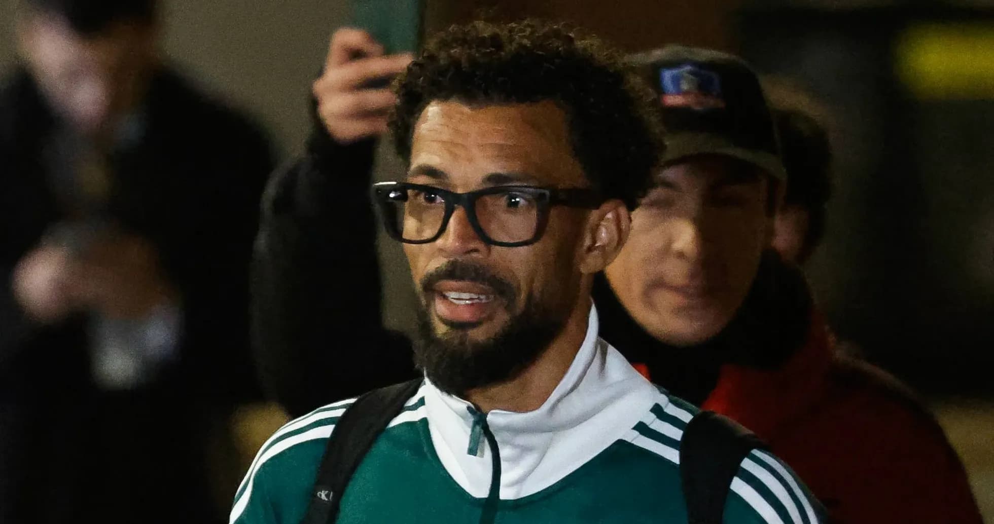 Player arriving at venue wearing team tracksuit