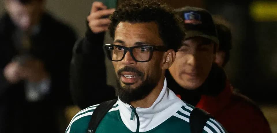 Player arriving at venue wearing team tracksuit