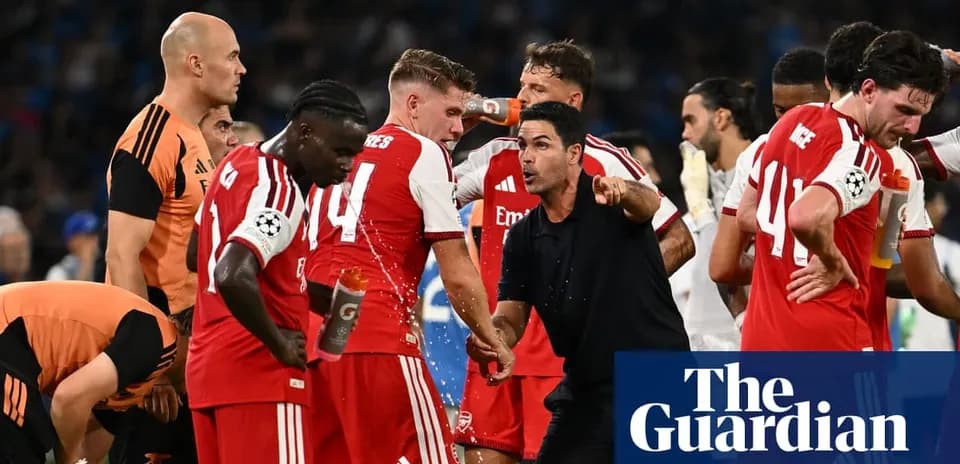 Arsenal players and coach discussing during match break