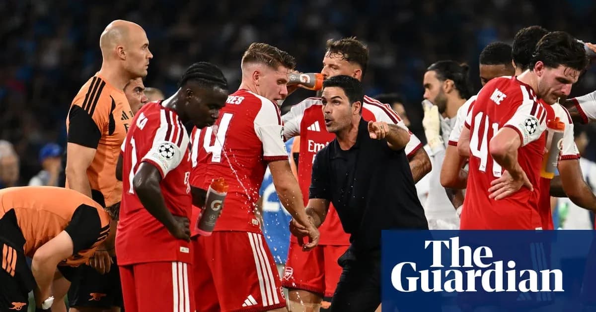 Arsenal players and coach discussing during match break