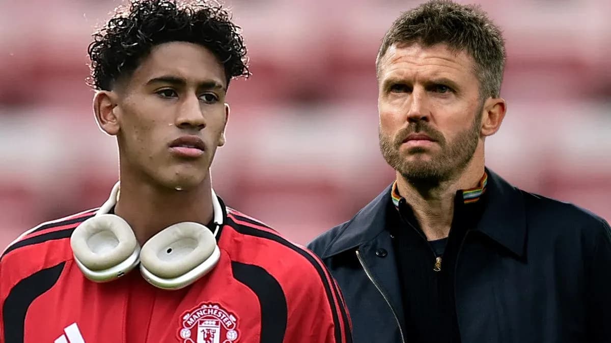 Young player in Manchester United kit with coach